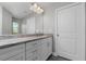 Elegant bathroom with a large mirror, vanity, granite countertops, and modern fixtures at 8270 Cook Ct, Port Charlotte, FL 33981
