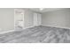 Spacious bedroom featuring a ceiling fan, ensuite bathroom and wood-look tile floors at 8270 Cook Ct, Port Charlotte, FL 33981