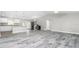 Open-concept layout showcasing the kitchen and living room with modern flooring and plenty of space at 8270 Cook Ct, Port Charlotte, FL 33981