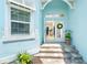 Inviting front entrance featuring double doors, tile floors, and view to the interior of the home at 8952 Scallop Way, Placida, FL 33946