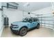 Spacious two car garage featuring a late model SUV and plenty of room for storage at 8952 Scallop Way, Placida, FL 33946