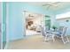 The inviting lanai offers dining and exterior views at 8952 Scallop Way, Placida, FL 33946