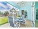 The screened lanai provides views of natural landscape at 8952 Scallop Way, Placida, FL 33946