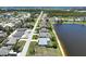 Panoramic aerial view of the waterfront community with serene pond views and lush landscaping with coastal access at 9064 Bantry Bay Blvd, Englewood, FL 34224