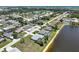Aerial view of the charming neighborhood featuring scenic pond views, and mature trees with coastal proximity at 9064 Bantry Bay Blvd, Englewood, FL 34224