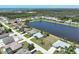 Aerial view of the lakefront community offering beautiful homes and serene water views near coastal amenities at 9064 Bantry Bay Blvd, Englewood, FL 34224
