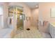 Bathroom featuring a glass shower, tiled floors, and a separate tub at 9064 Bantry Bay Blvd, Englewood, FL 34224