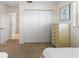 Bedroom featuring two twin beds, a closet, and a dresser at 9064 Bantry Bay Blvd, Englewood, FL 34224