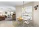 Cozy breakfast nook with a view overlooking the pool area, adjacent to the living room at 9064 Bantry Bay Blvd, Englewood, FL 34224