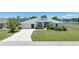 Charming single-story home featuring a well-maintained lawn and a driveway leading to an attached garage at 9064 Bantry Bay Blvd, Englewood, FL 34224