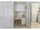 Convenient office nook with functional desk and storage adds practical utility to home's layout at 9064 Bantry Bay Blvd, Englewood, FL 34224