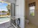 Bathroom accessible from the screened in pool area at 9064 Bantry Bay Blvd, Englewood, FL 34224