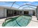Screened in pool with an attached patio at 9064 Bantry Bay Blvd, Englewood, FL 34224