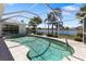 Screened in pool with lake view and well manicured landscaping at 9064 Bantry Bay Blvd, Englewood, FL 34224