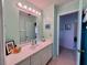 Inviting bathroom with a large mirror, ample counter space, and stylish fixtures, providing a comfortable and functional space at 9270 Little Gasparilla Is, Placida, FL 33946
