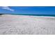 Expansive sandy beach with gentle waves and a clear horizon at 9270 Little Gasparilla Is, Placida, FL 33946