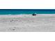Peaceful beach scene with turquoise water and relaxing chairs at 9270 Little Gasparilla Is, Placida, FL 33946