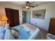 Comfortable bedroom featuring wood floors, closet, and tropical bedding, ideal for a relaxing getaway at 9270 Little Gasparilla Is, Placida, FL 33946