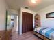 Cozy bedroom featuring hardwood floors, closet, and a serene atmosphere, perfect for relaxing at 9270 Little Gasparilla Is, Placida, FL 33946