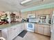 Well-equipped kitchen featuring plentiful counter space, essential appliances, and functional design for everyday cooking needs at 9270 Little Gasparilla Is, Placida, FL 33946