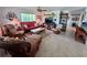 Comfortable living room with wicker furniture and view to bar counter at 9270 Little Gasparilla Is, Placida, FL 33946