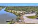Picturesque waterfront park with a pier, basketball court, playground, and picnic area, ideal for Gathering activities at 9532 Miami Cir, Port Charlotte, FL 33981