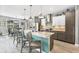 This open-concept kitchen features an island with seating, and stainless appliances, great for entertaining at 9532 Miami Cir, Port Charlotte, FL 33981