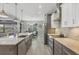 Spacious kitchen features a center island and stainless appliances, and it opens to a dining area at 9532 Miami Cir, Port Charlotte, FL 33981