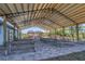 Spacious covered picnic area with multiple tables, perfect for gatherings and outdoor entertaining in a relaxed setting at 9532 Miami Cir, Port Charlotte, FL 33981