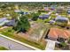 Aerial view showcasing property's location amidst a residential area, highlighting spacious lots and surrounding landscape at 9869 Gulfstream Blvd, Englewood, FL 34224