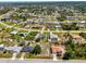 Aerial view of homes showcases neighborhood layout and the property's location within a residential community at 9869 Gulfstream Blvd, Englewood, FL 34224