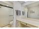 Bathroom featuring a walk-in shower, vanity with storage, and modern fixtures at 9869 Gulfstream Blvd, Englewood, FL 34224