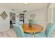 Casual dining area showcasing a round wood table and seating for four at 9869 Gulfstream Blvd, Englewood, FL 34224