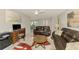 Living room with desk area, and open dining room and sliding glass doors at 9869 Gulfstream Blvd, Englewood, FL 34224
