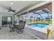 Enjoy outdoor living with a private pool, screened lanai, and comfortable seating area, great for entertaining at 9869 Gulfstream Blvd, Englewood, FL 34224