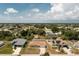 This aerial view showcases the property within a tranquil neighborhood surrounded by lush landscapes at 10116 Melanie Ave, Englewood, FL 34224