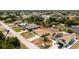 An aerial perspective of the property displaying its location in a quaint, tree-lined community at 10116 Melanie Ave, Englewood, FL 34224