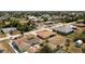 A clear aerial view highlights the home nestled in a residential neighborhood with mature trees at 10116 Melanie Ave, Englewood, FL 34224