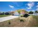 Exterior showing the driveway leading to the white garage door at 10116 Melanie Ave, Englewood, FL 34224