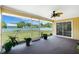 The screened lanai provides additional living space with a view of the lush backyard and privacy at 10116 Melanie Ave, Englewood, FL 34224