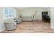 Comfortable living room featuring wood-look floors and comfortable seating at 10116 Melanie Ave, Englewood, FL 34224