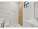 Sleek bathroom features tiled walk-in shower and a modern vanity with stylish finishes at 10242 Hallendale Dr, Port Charlotte, FL 33981