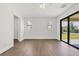 Bright bedroom featuring tile floors and a sliding glass door to the patio at 10242 Hallendale Dr, Port Charlotte, FL 33981