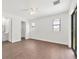 Well-lit bedroom with tile flooring, a ceiling fan and a sliding door to the outside at 10242 Hallendale Dr, Port Charlotte, FL 33981
