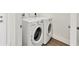 This laundry room features modern, front-load washing and drying machines at 10242 Hallendale Dr, Port Charlotte, FL 33981