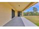 This covered patio offers outdoor living space and views of the backyard at 10242 Hallendale Dr, Port Charlotte, FL 33981