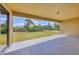 This covered patio offers a nice view of the rear yard at 10242 Hallendale Dr, Port Charlotte, FL 33981