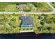 Beautiful aerial view of waterfront home with private pool and dock on a sunny day at 10454 Atenia St, Port Charlotte, FL 33981