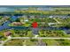 Aerial view of a canal front home, complete with boat dock, and marked with location pin at 10454 Atenia St, Port Charlotte, FL 33981
