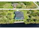 Aerial view of a beautiful home showcasing the backyard pool, patio and canal front with dock at 10454 Atenia St, Port Charlotte, FL 33981
